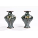 Pair of Royal Doulton vases with raised art nouveau floral decoration, impressed and incised marks