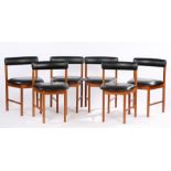 Set of six 1970's dining chairs, with black leatherette upholstered curved cresting rails and seats,