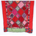 Turkish patchwork wall hanging, with diamond pattern centre surrounded by a red, green and floral