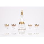 Gilt decanter and four glasses, with dot and banded decoration, the decanter 33cm high, (5)