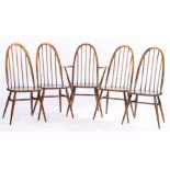 Five Ercol Quaker spindle back dining chairs with solid dished seats and turned legs, comprising