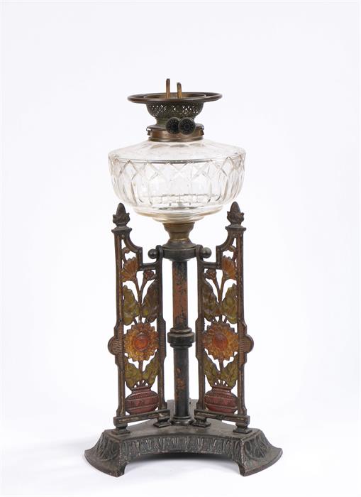 Youngs Duplex oil lamp, with clear glass reservoir, the cast base with urn form finials and