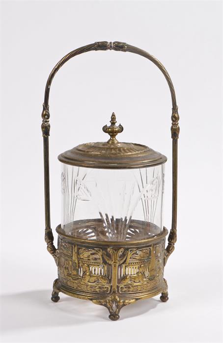 W.M.F. biscuit barrel, with twisted cast handle, cover with urn form finial, glass lower section,