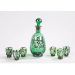 Green glass decanter and six tumblers, the decanter with silver gondola and floral decoration, the