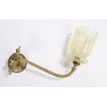 Vaseline glass wall light, with a gilt metal fitting and long curved arm to the Vaseline glass