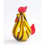 Laguna glass chick, with a yellow and brown streak body, red applied glass to the back and head,