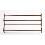 Ercol oak wall mounted plate rack, the two shelves with plate grooves, 96.5cm wide