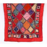 Turkish patchwork wall hanging, with polychrome diamond pattern centre surrounded by a patchwork