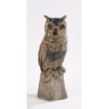 Carved marble figure of an owl with amber and black eyes, 42.5cm high