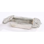 Liberty & Co, Archibald Knox, a Tudric polished pewter rectangular butter dish with compressed spade