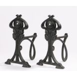 Pair of Mackintosh style fire dogs, with pierced scroll and foliate decoration, 27cm high