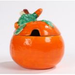 Clarice Cliff Bizarre preserve pot, in the form of an orange, with a leaf handle above the orange