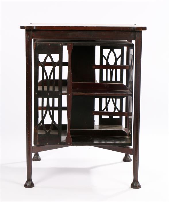 Edwardian mahogany revolving bookcase, in the style of Liberty, the top with canted corners, the