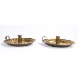 Pair of brass Arts and Crafts period chamber sticks with repousse fruiting foliage decoration and