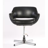 Black leatherette swivel armchair, the upholstered back with pierced lower section, on a chrome stem