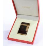 S.T. Dupont Paris cigarette lighter, the black enamel panels with copper sparkle decoration,