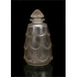 Lalique perfume bottle and stopper, the frosted body with raised graduated beaded swag decoration,