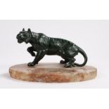 Mid 20th Century desk tidy, with a green patinated metal model of a tiger above a base with a dished