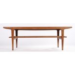 Ercol style coffee table, the rectangular top on shaped tapering supports, united by a flattened