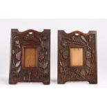 Pair of carved oak frames, the scrolled pierced pediments above foliate carved borders, 27cm x 36cm