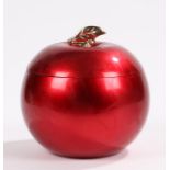 Asprey ice bucket, of apple form, with polished red exterior and gilt leaf finial, 20cm high