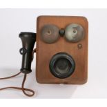 Kellogg wooden cased wall mounted telephone, with mouth piece to the left hand side, the front