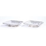 Pair of silver plated dishes by D Gallia France, the square dishes with scroll and stylised leaf