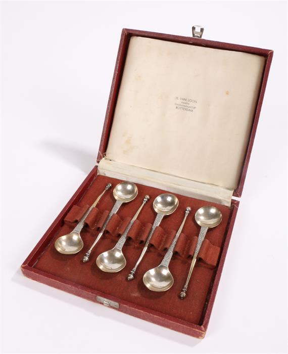 Set of six Dutch White metal tea spoons, with circular bowls, tapering scroll decorated stems and