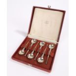 Set of six Dutch White metal tea spoons, with circular bowls, tapering scroll decorated stems and