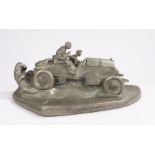 Resin desk stand, in the form of a vintage car travelling at speed, the bonnet opening to reveal a