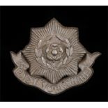 World War Two plastic economy cap badge to the East Yorkshire Regiment, in light bronze, two