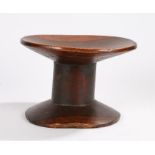 Late 19th Century Shona stool, with a dish top above the thick column and conforming base, 30cm x