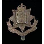 World War One brass economy O/R's cap badge to the East Surrey Regiment, slider to the reverse