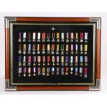 Collection of copy miniature medals, sixty miniature examples in total, framed