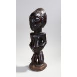 African Luba figure, Congo, the bearded figure holding his stomach, 49cm high