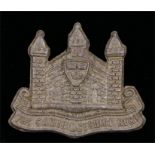 Scarce World War Two plastic economy cap badge to the Cambridgeshire Regiment, in light bronze,