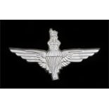 World War Two plastic economy cap badge to the Parachute Regiment, in silver grey, two blades to the