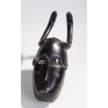 Fine African Guro mask, with snake head above zigzag eyebrows painted eyes and scar carving marks to