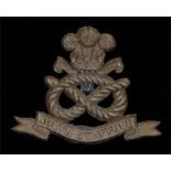 World War Two plastic economy cap badge to the North Staffordshire Regiment, in light bronze, one of