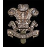 World War One brass economy O/R's cap badge to the Welsh Regiment, slider to the reverse