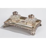 Silver plated desk stand, mongrammed to centre EE, with two plate mounted glass inkwells, two pen