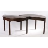 Pair of George III mahogany demi lune tables, both with bow fronts raised on channel moulded