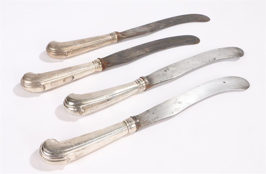 Four Georgian table knives, the silver pistol grip handles with makers mark T.S and bearing a