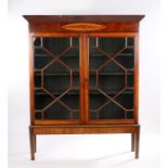Victorian mahogany bookcase, the pediment above a foliate and scroll inlaid frieze and two