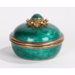 Silver gilt and green enamel pot and cover, the pearl and green stone inset, scroll decorated finial