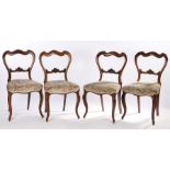 Set of four Victorian rosewood balloon back dining chairs, the arched balloon backs above a stuff