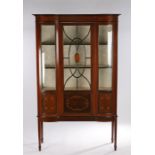 Edwardian display cabinet, the bow fronted cabinet glazed sides with astragal glazed central door