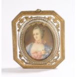 19th Century miniature, of a lady in a blue and pink dress, housed within a gilt metal frame, 11.5cm