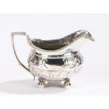 George III silver milk jug, Newcastle marks rubbed, with angular reeded handle, gadrooned rim,