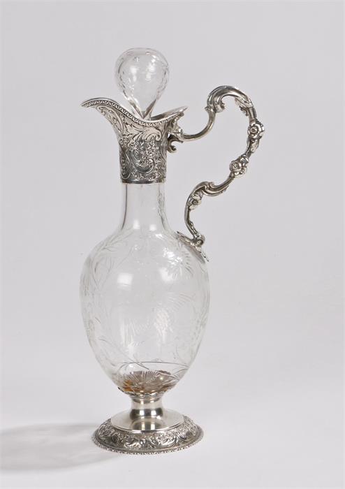 Edward VII silver claret jug, London 1904, maker William Comyns & Sons, with blown foliate